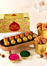 Holi sweets including Thandai Laddoo, Pan Laddoo, Samosa, and Bhakarwadi, and herbal gulal.