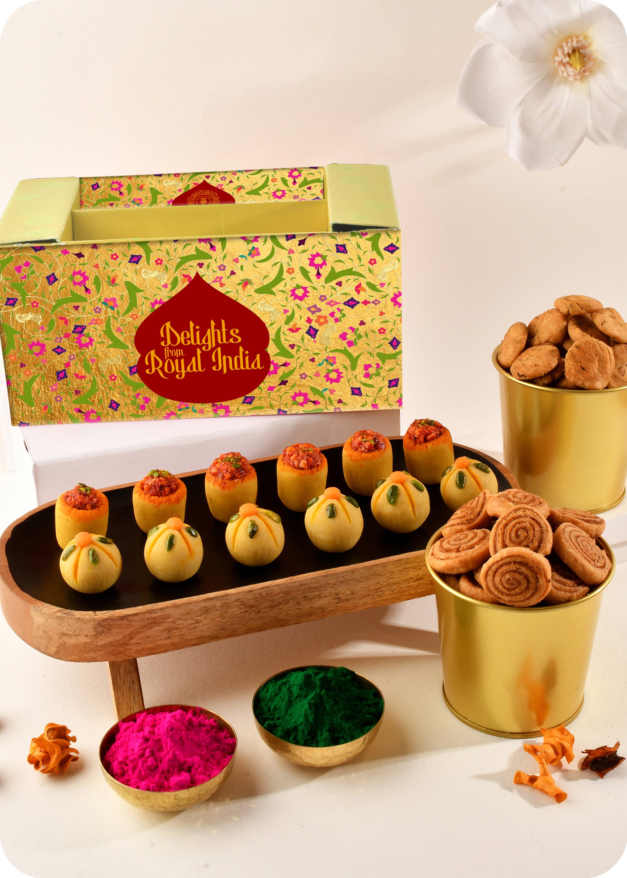 Holi gift pack for festive celebrations thandai ladoo, pan ladoo, methi sawli, bhakrwadi and herbal gulal.