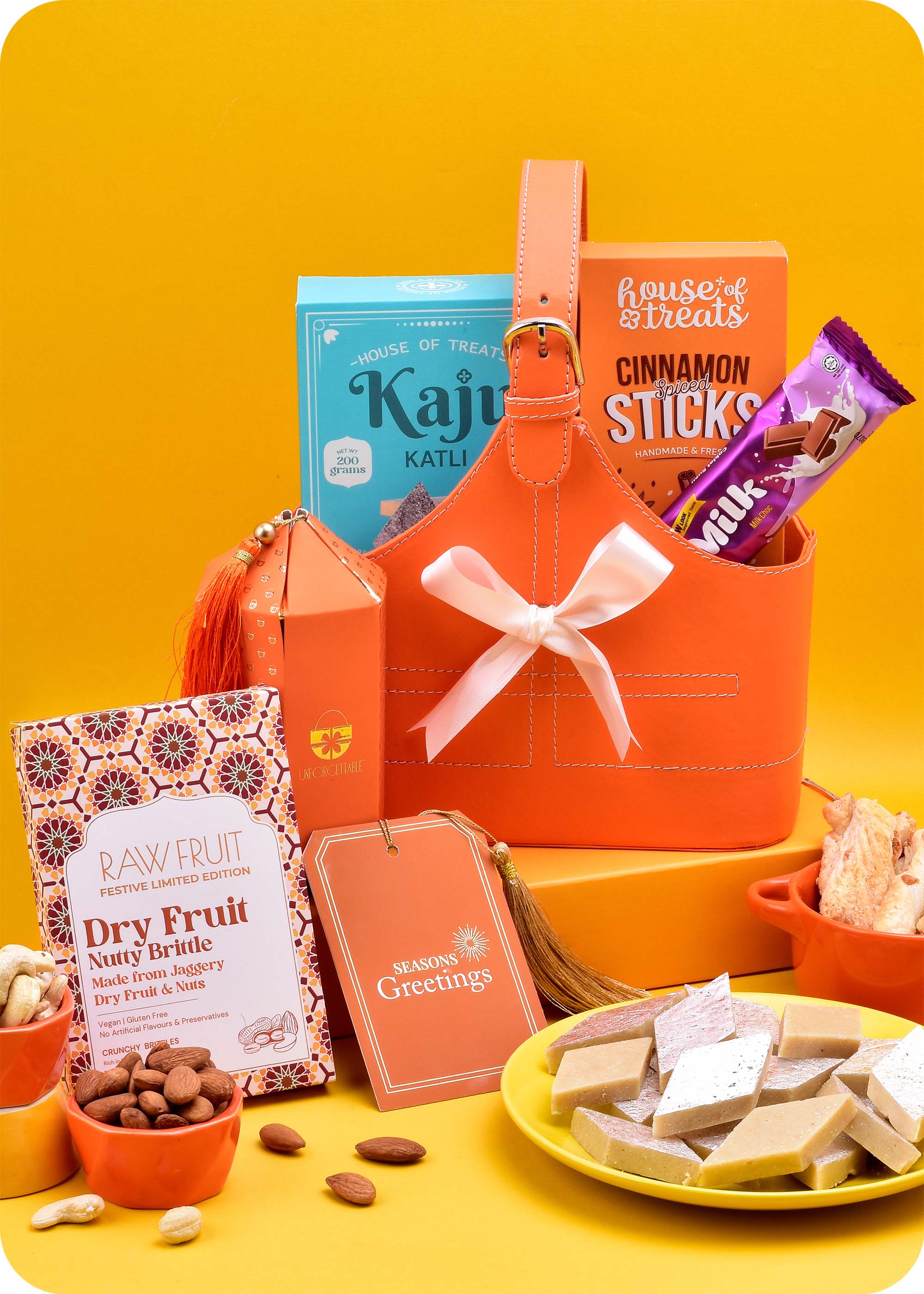 Gift Hamper: Sweets, Snacks with Brittle including kaju katli, dry fruit nutty brittle, cinnamon sticks snacks, milk chocolate bar, cashews, almonds