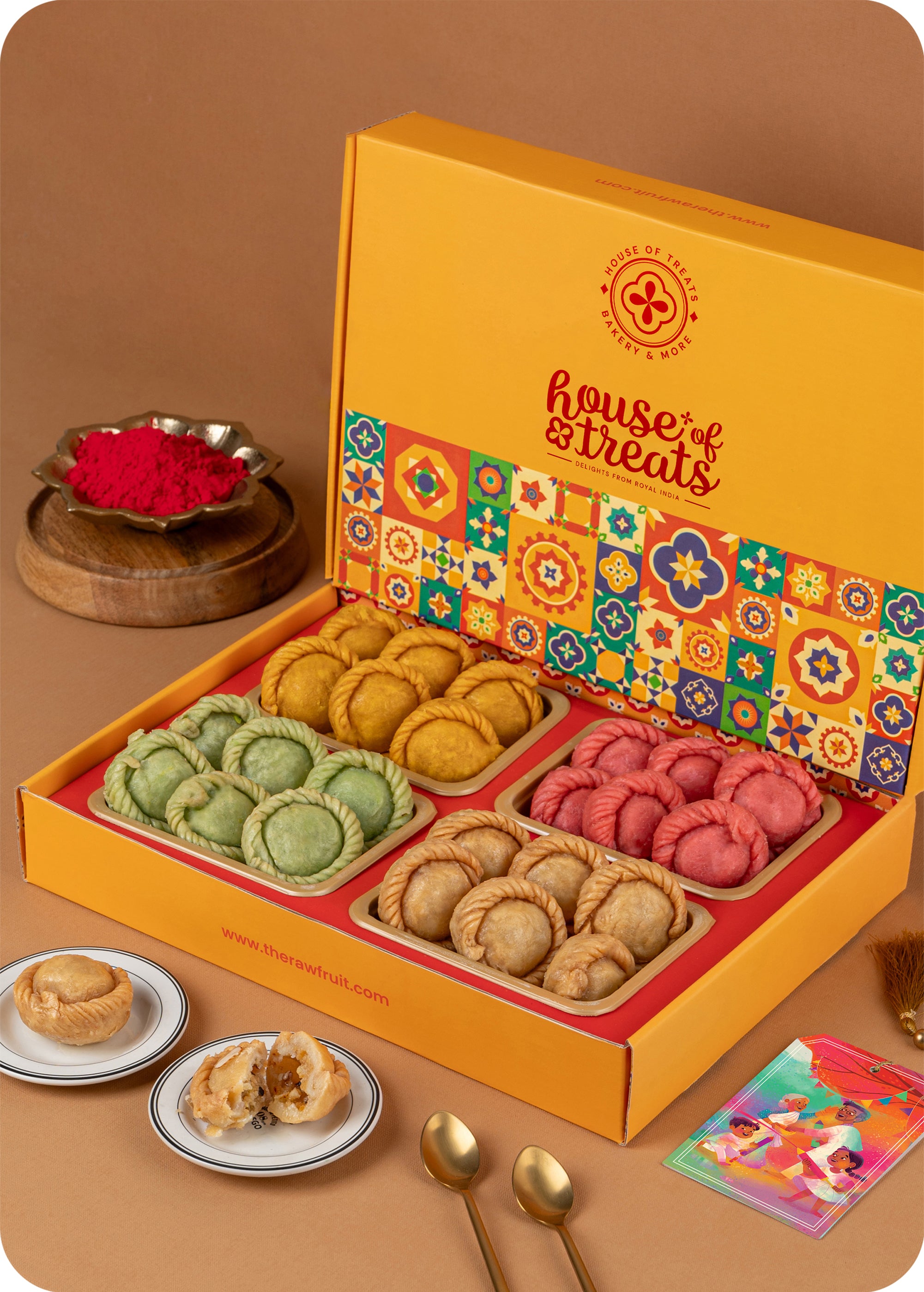 A holi gift pack of Assorted Rose, Pista & Kesar Chandrakala sweets with herbal gulal.