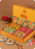 A holi gift pack of Assorted Rose, Pista & Kesar Chandrakala sweets with herbal gulal.