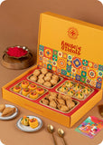 A colorful Holi gift pack box from House of Treats, containing various traditional Indian sweets including Thandai laddoo, Pan laddoo, Kachori, and Samosa.