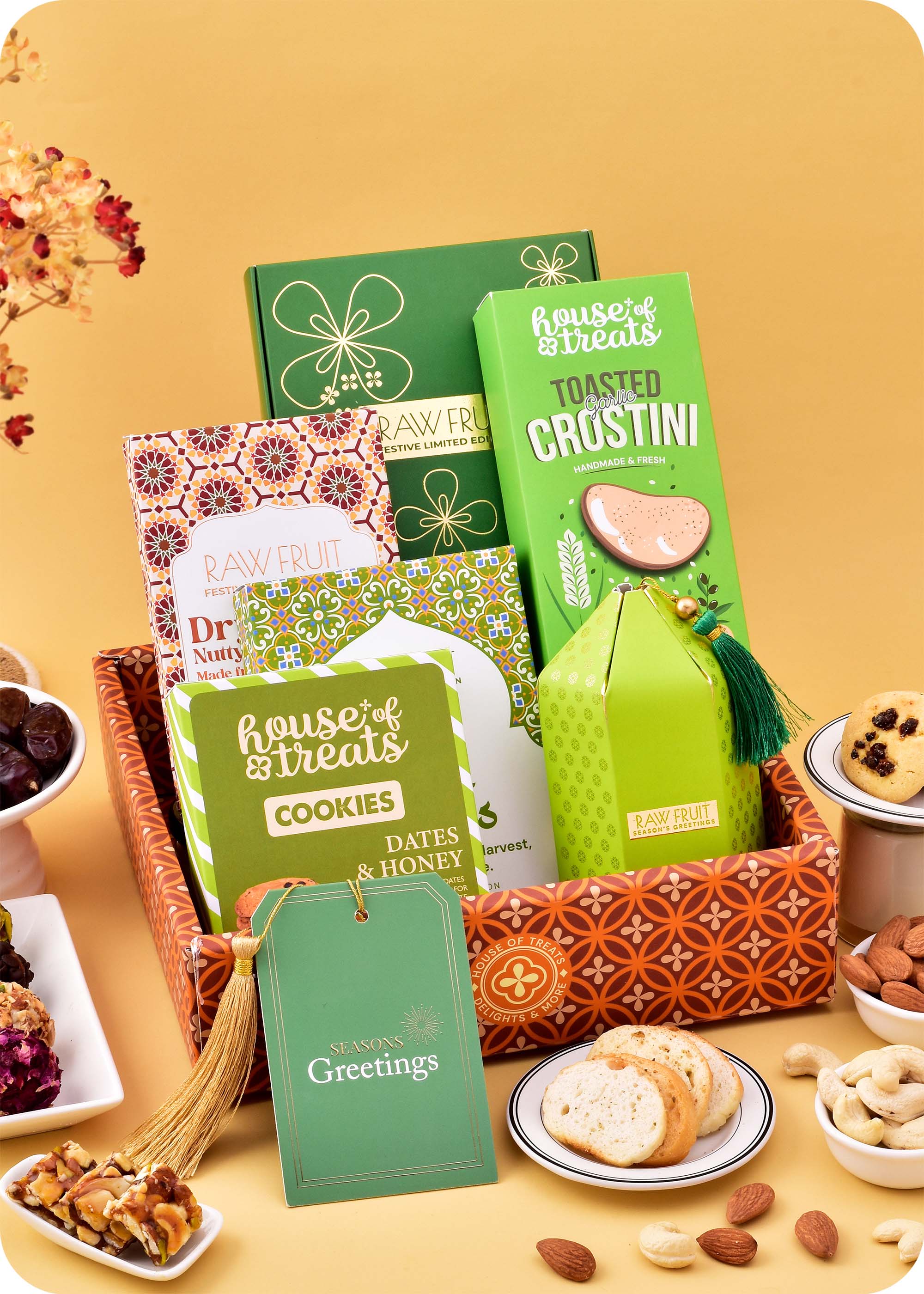 Sweets, Snacks & Brittle with Cookies Gift Hamper including dates & honey cookies, dubai dates, dry fruit nutty brittle, garlic crostini and ladoo