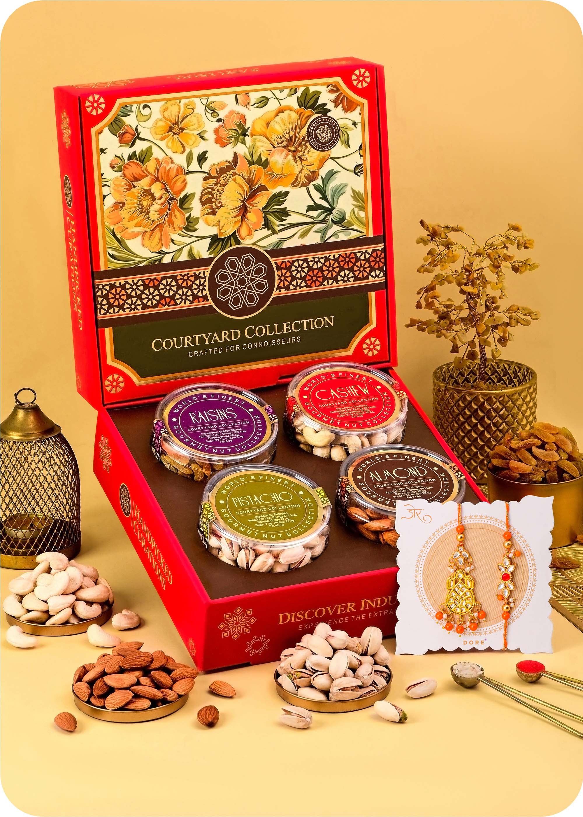 Courtyard Collection - 495 Grams Set of 4 Dry Fruits with Bhaiya Bhabhi Rakhi Set cashews, almonds, raisins and pistachios.