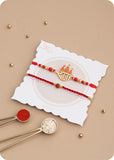 Pack of 12 Artisanal Ladoo Sweets with Rakhi Set of 2