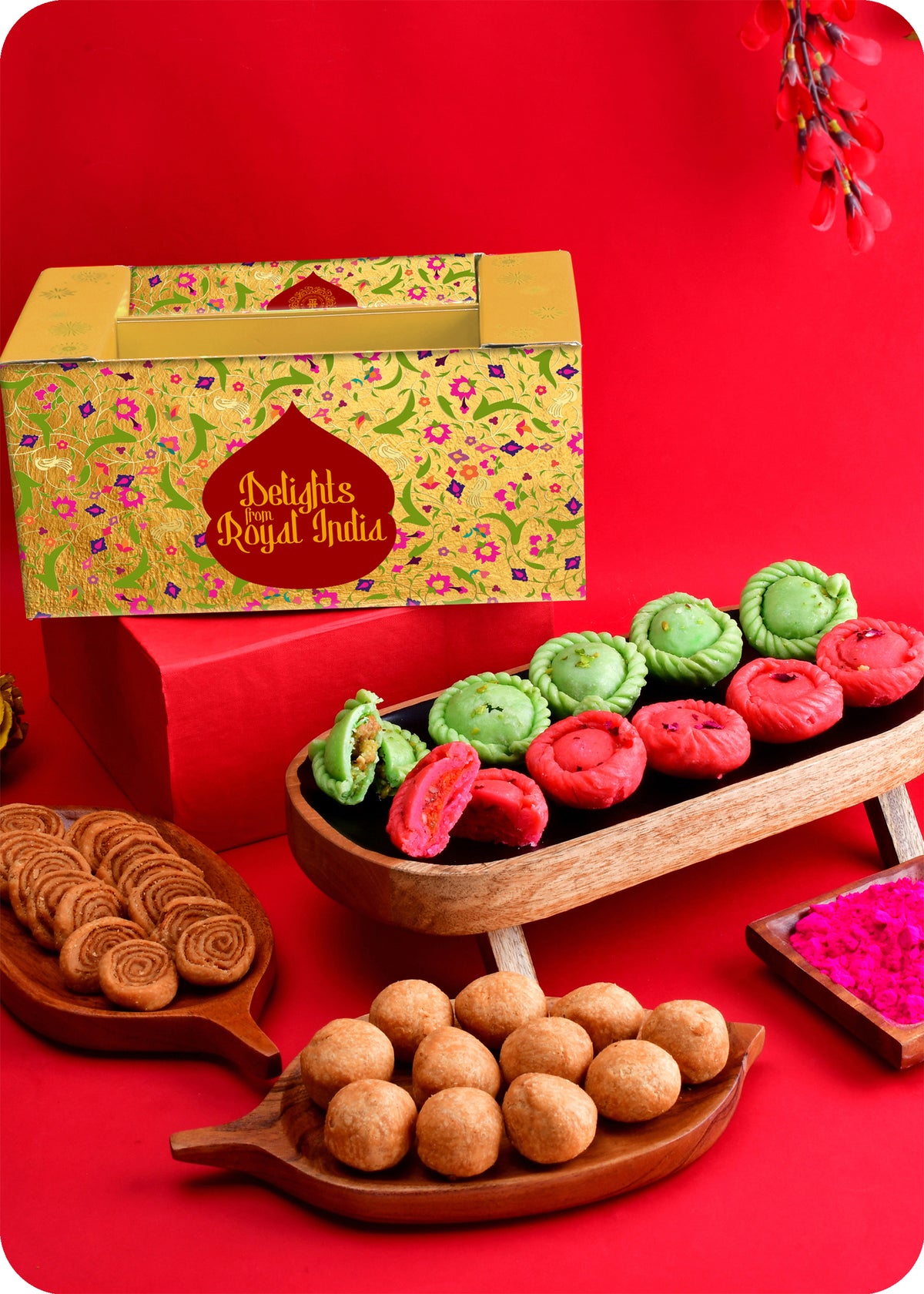 A colorful assortment of Indian sweets including Pista & Rose Chandrakala, Kachori, and Bhakarwadi, and Herbal Gulal on this pack.