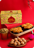 A Holi gift pack containing Shahi Gujiya, Pudhina Paare, Kachori and herbal gulal.